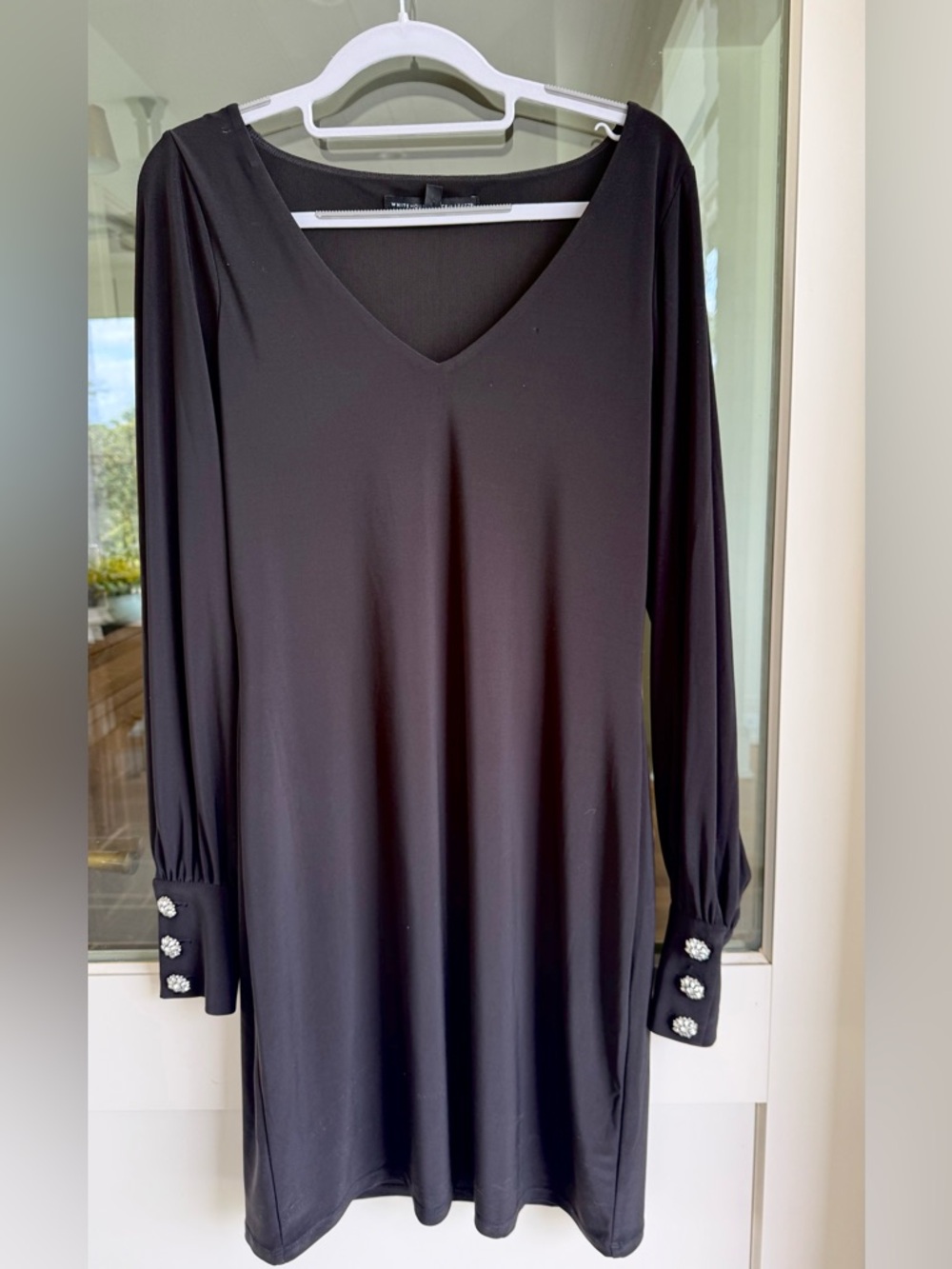 Black cocktail dress with rhinestone button on cuff